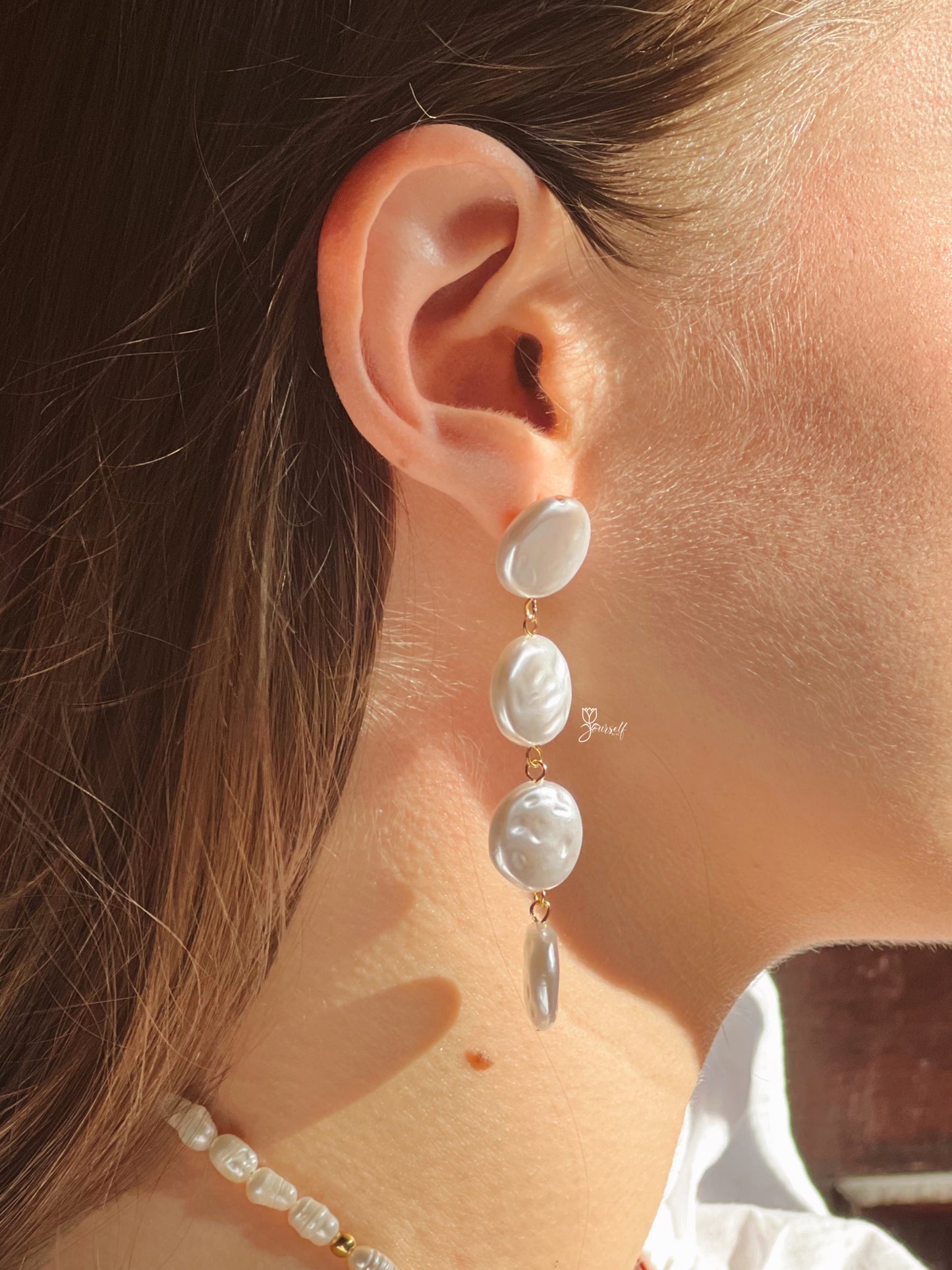 Aritos perlas largos